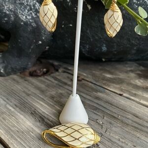 Trifari conch cream and gold tone earrings and brooch. Vintage, preowned.
